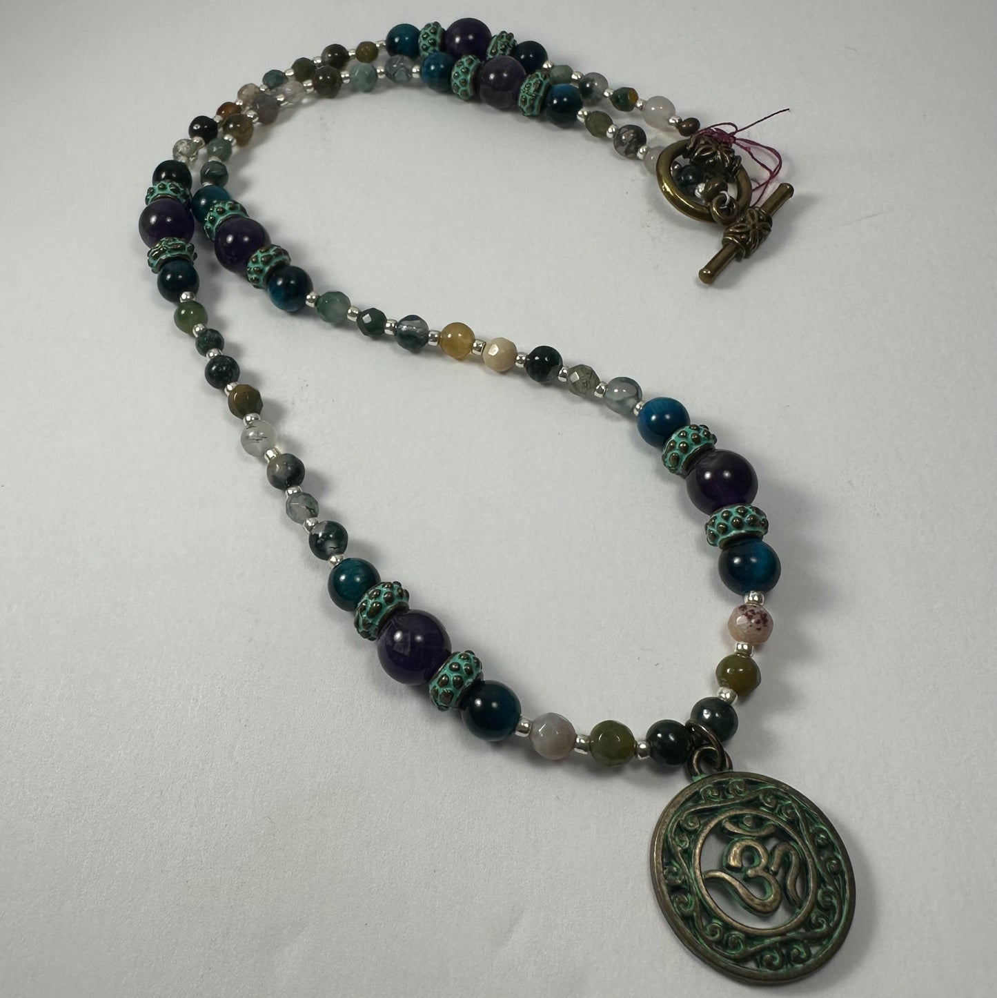 Bronze Patina 'Om' Pendant on Mixed Bead Necklace